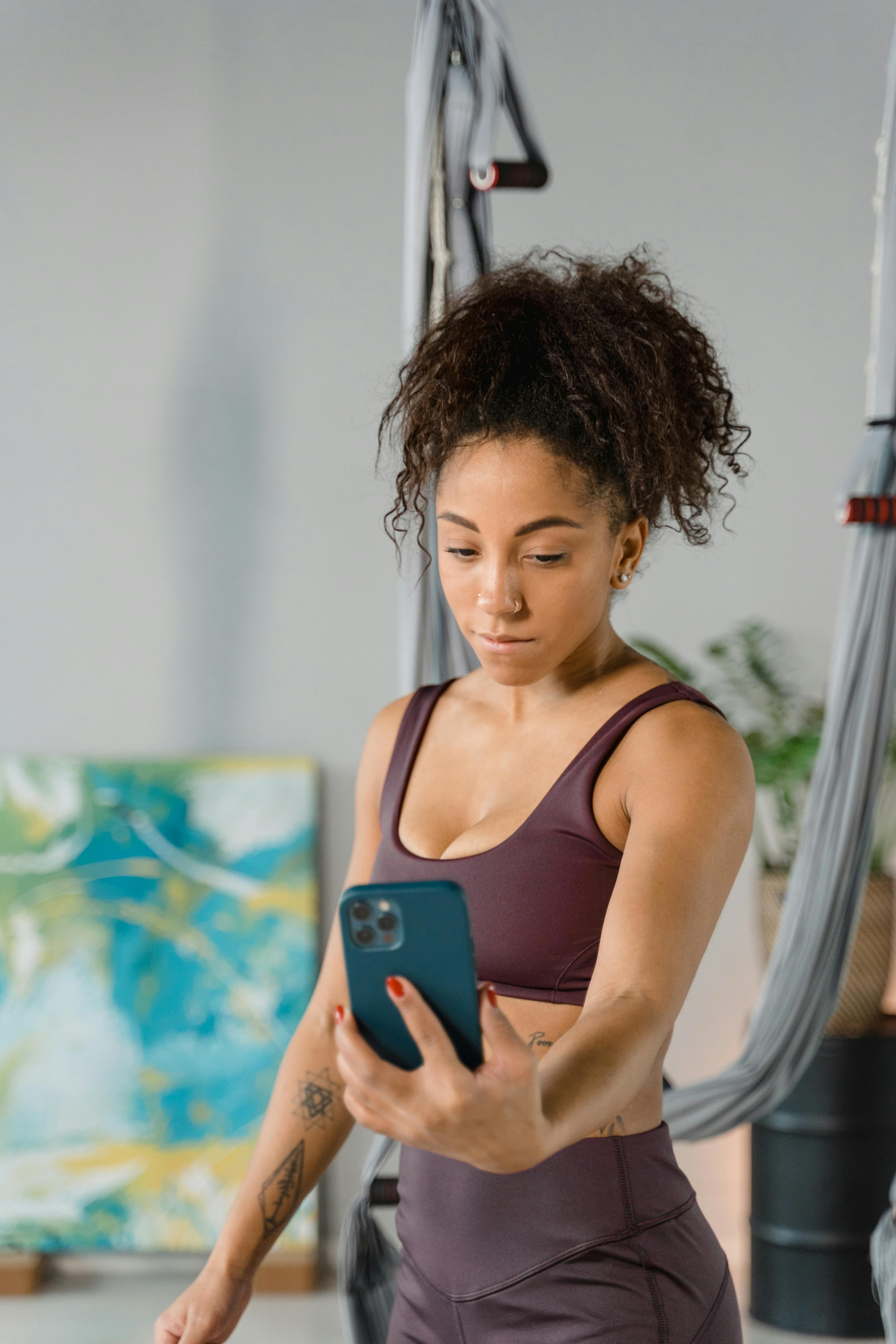 Athlete checking mobile coaching feedback during a workout